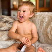 baby with happy baby oil