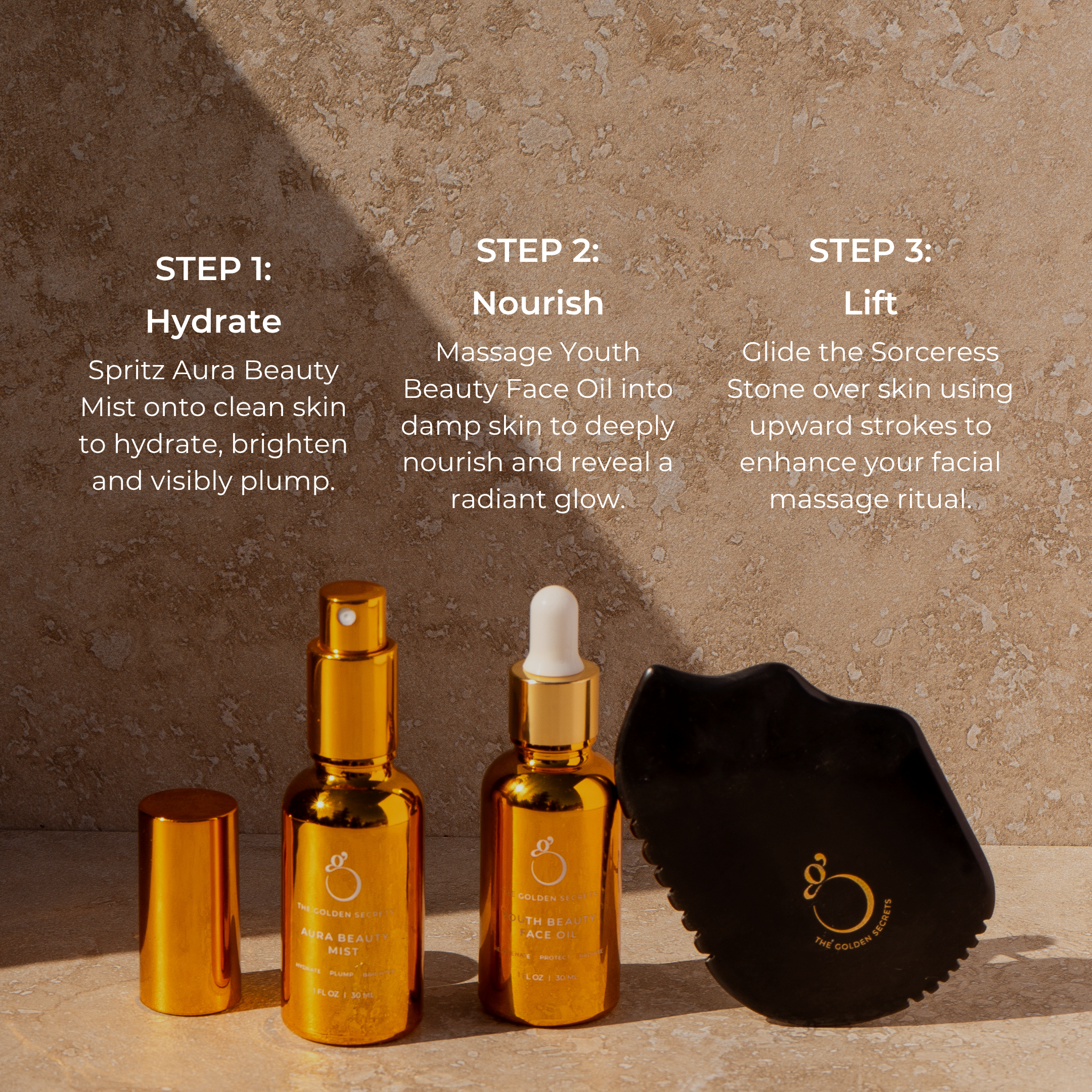 Three golden bottles of THE GOLDEN SECRETS Dynamic Duo and a black gua sha stone are arranged on a sunlit tan surface, highlighting key essentials such as a hydrating mist and face oil. Above the products, instructions for a three-step facial routine—Hydrate, Nourish, Lift—are displayed.