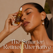 A woman with glowing skin holds a bottle of THE GOLDEN SECRETS Dynamic Duo serum to her face, complemented by pearl earrings and bathed in warm sunlight. Text reads: The Smarter Retinol Alternative—Dynamic Duo, perfectly paired with your favorite hydrating mist for luminous, healthy-looking skin.
