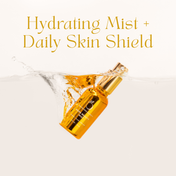 Set against a light background, a gold spray bottle from THE GOLDEN SECRETS Hydrate & Heal Duo is partially submerged in water with a dramatic splash. Gold lettering above reads “Hydrating Mist + Daily Skin Shield,” highlighting this duo’s formulation to support your skin barrier and maintain a healthy microbiome.