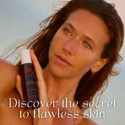 A woman with glowing skin holds THE GOLDEN SECRETS Cleansing Duo. Text on image reads, Discover the secret to a radiant complexion. She stands against a soft, blurred background.