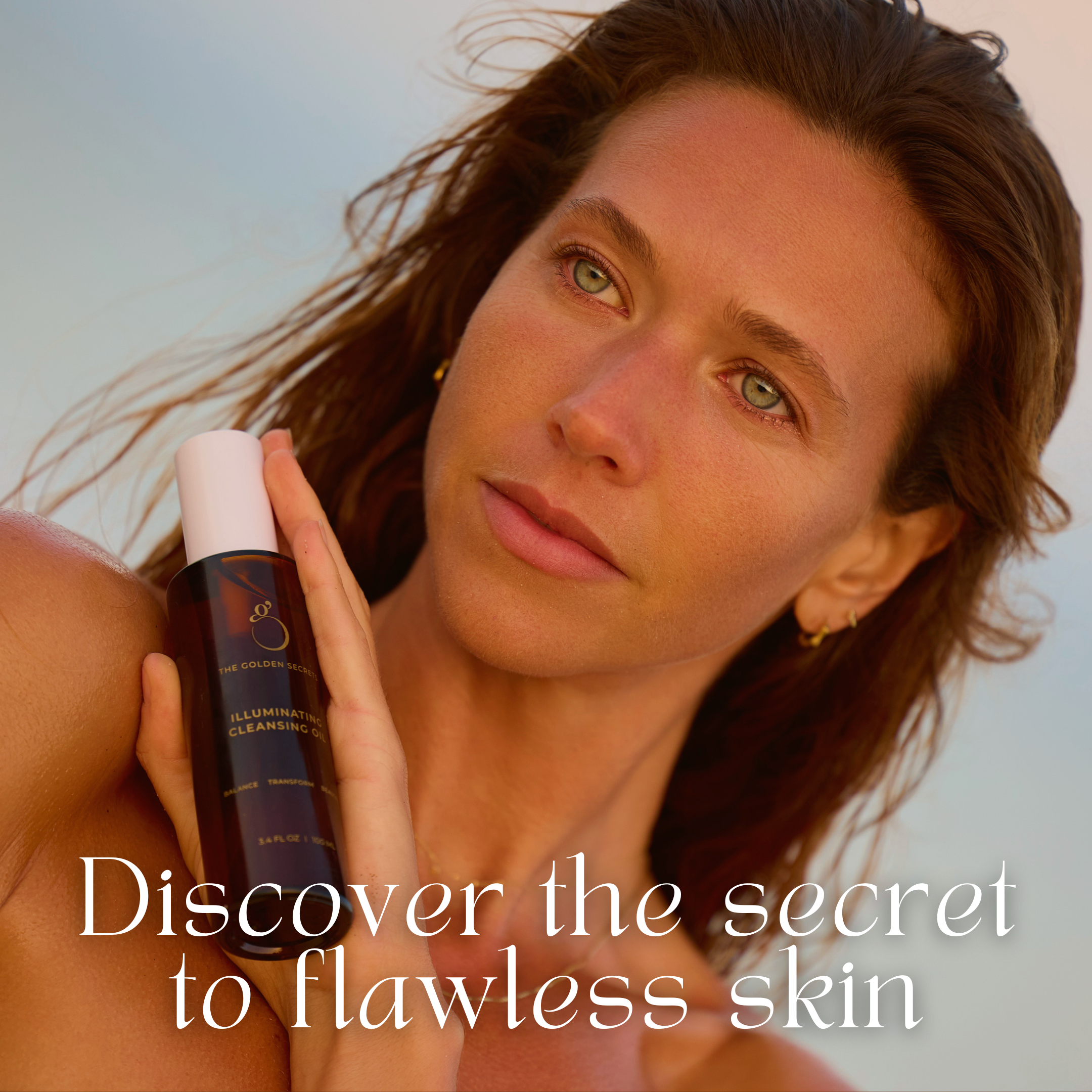A woman with glowing skin holds THE GOLDEN SECRETS Cleansing Duo. Text on image reads, Discover the secret to a radiant complexion. She stands against a soft, blurred background.