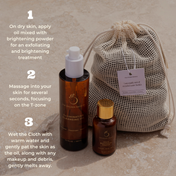 Three bottles from THE GOLDEN SECRETS Cleansing Ritual Kit and a mesh cloth bag are arranged on a neutral surface. Step-by-step instructions, labeled 1–3, detail how to use the oil, powder, and cloth for a brightening skincare routine—providing an all-in-one kit designed to effectively remove makeup while supporting optimal cleansing.
