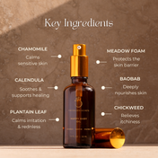 A bottle of THE GOLDEN SECRETS Happy Baby Oil, a gentle organic baby oil ideal for sensitive skin, sits centered on a stone surface. Surrounding it, text showcases its key ingredients—chamomile, calendula, plantain leaf, meadowfoam, baobab, and chickweed—emphasizing their soothing and nourishing benefits for delicate skin.