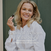 A smiling woman in a white blouse holds a small bottle of THE GOLDEN SECRETS Signature Blend Essential Oil. Text on the image reads, Botanical Alchemy for the Spirit. Harnessing the power of botanical aromatherapy, this blend promotes a sense of confidence and self-assurance. She stands in front of a green door.