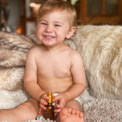 baby with happy baby oil