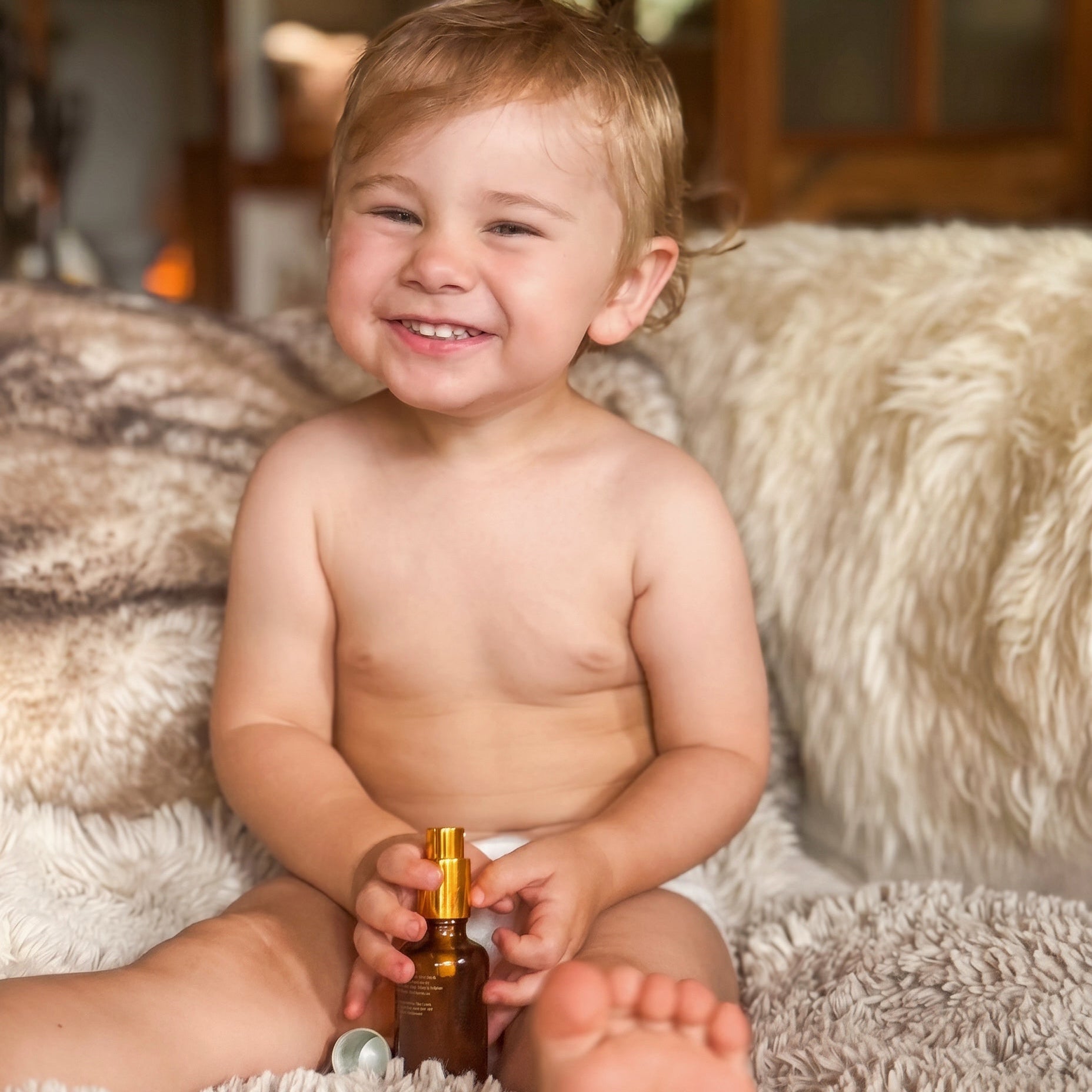 baby with happy baby oil