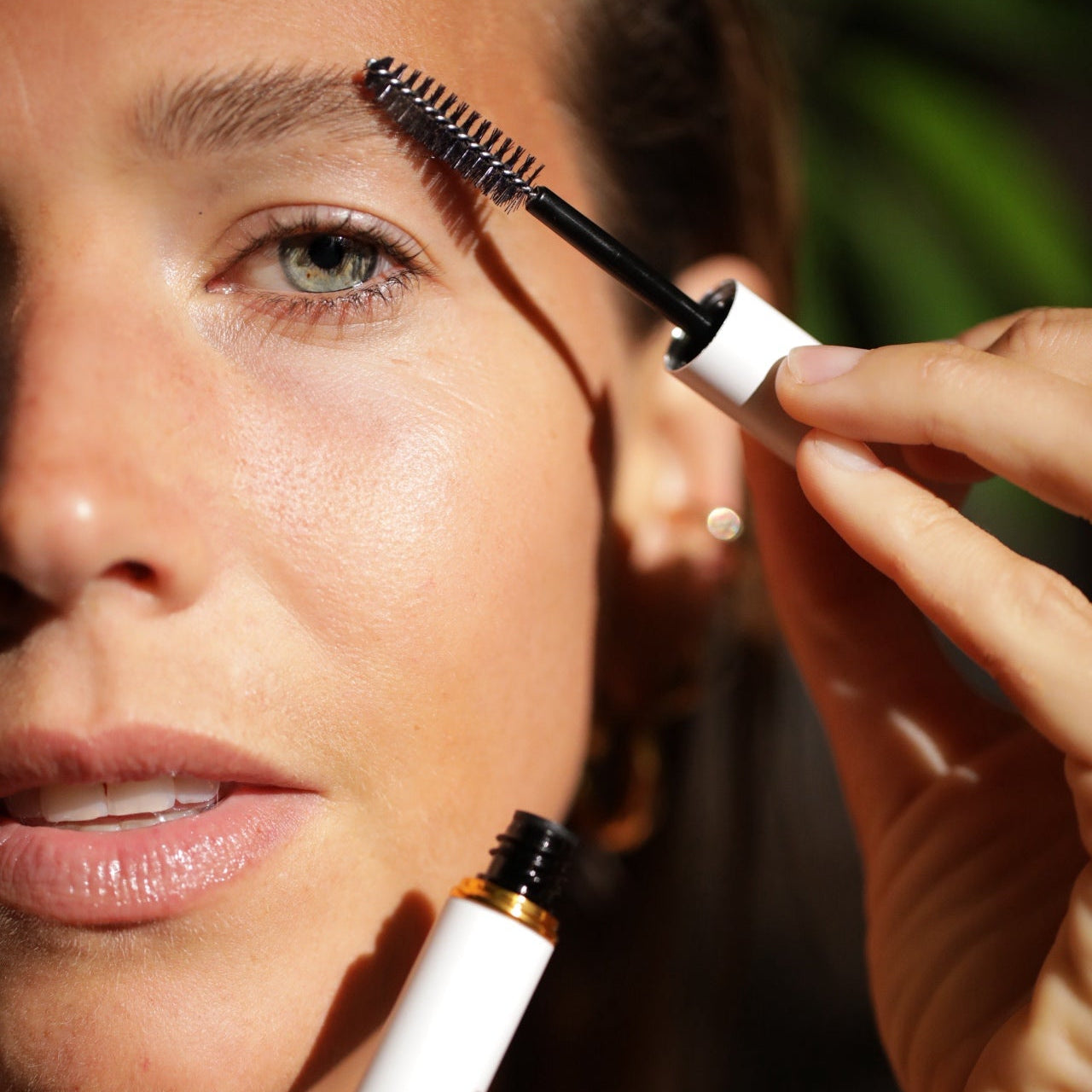 woman with full brow styling serum