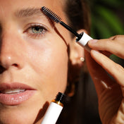 woman with full brow styling serum